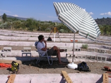 Researcher under beach umbrella